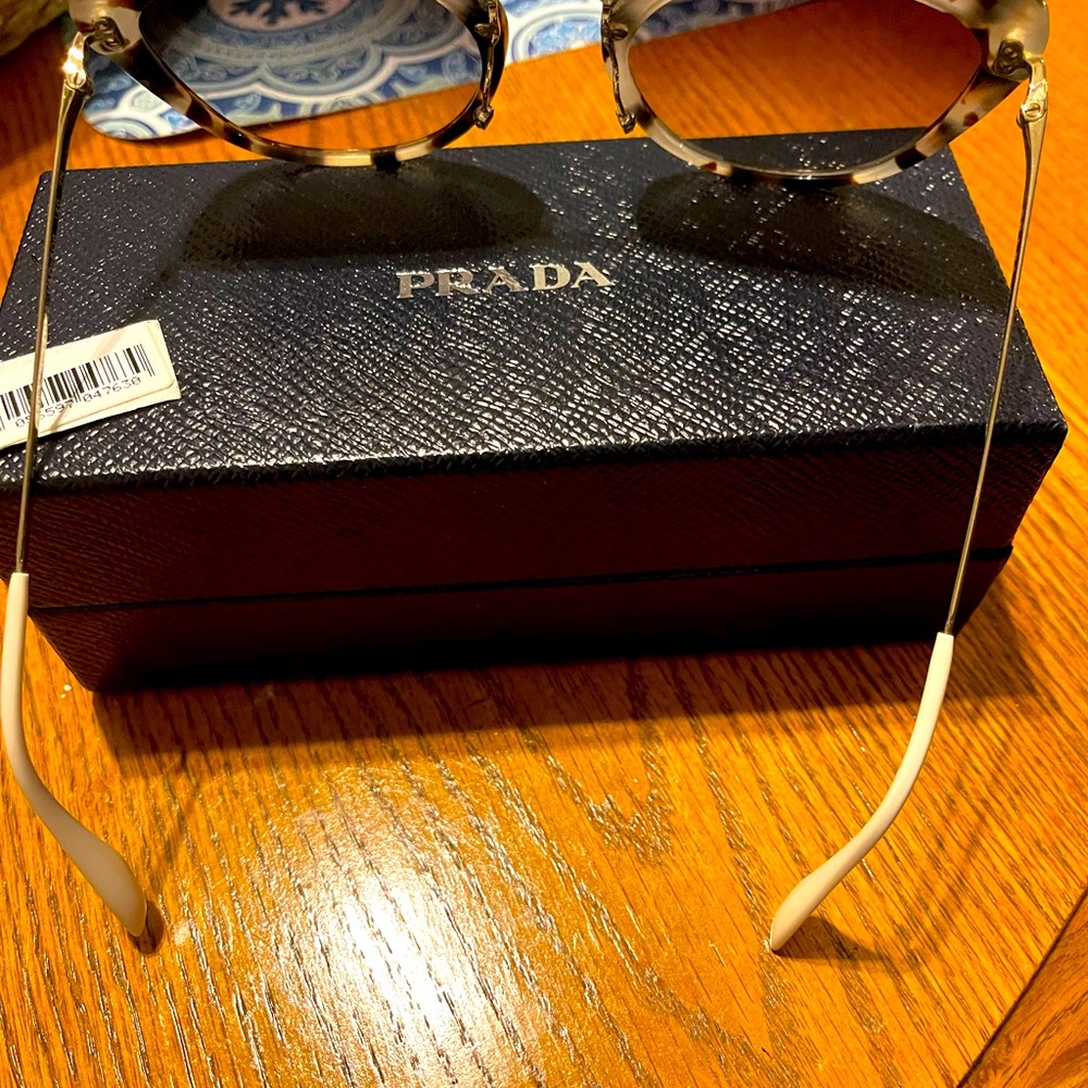Prada cat eye sunglasses. Tortoise shell. Missing plastic nose pieces.
